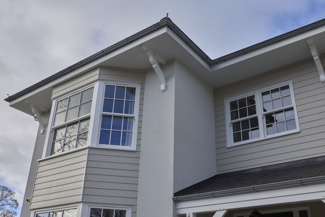 upwards view of timber bay windows as well as roofline products.