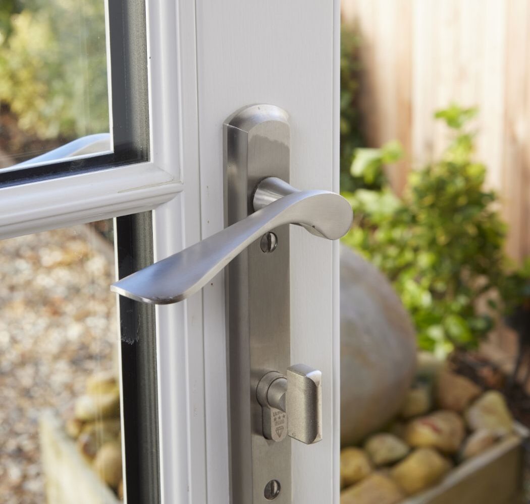 lever handle with thumb lock on door.