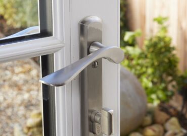 lever handle with thumb lock on door.